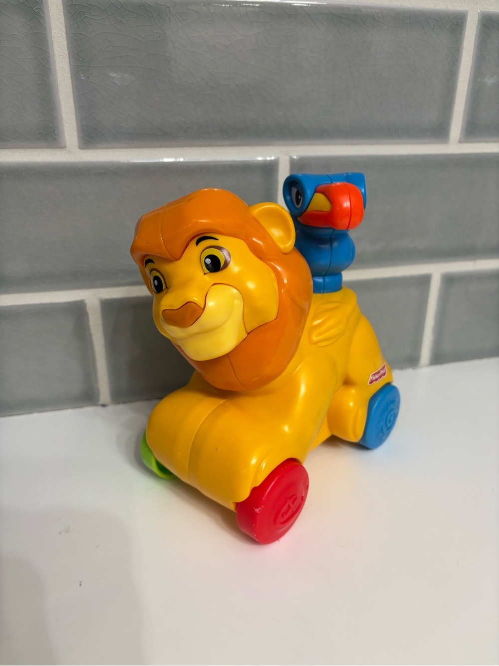 Fisher-Price Disney Baby Rollin' Tunes Mufasa push-along toy